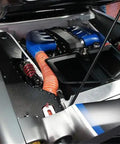 Car engine bay with SCAT Flex Duct Silicone Impregnated Fiberglass With Steel Wire Reinforcement For Intake, Cooling And HVAC Routing