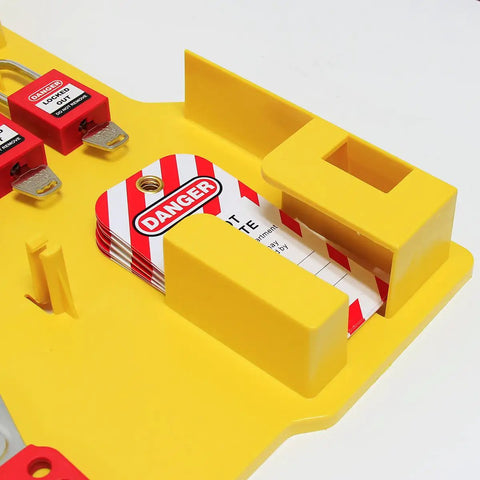 Close-up of Lockout Tagout Station with Cover, showing yellow PC plastic, padlocks, and safety tags, wall-mount setup.