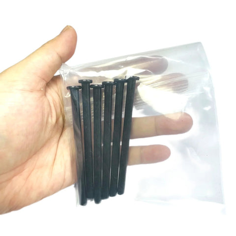 Hand holding Six Pack 4 Inch Interior Door Hinge Pins For Replacement Doors With Oil Rubbed Bronze Finish And Black Color Option