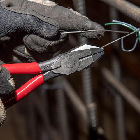 D201-7CSTA Linesman Pliers With Spring Loaded Action, kickass grip on wire, used by worker with gloves for wire cutting