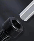 Close-up of a Hella Tough 1/4-20 X 1 Inch Socket Head Cap Screw, black oxide alloy steel with hex key.