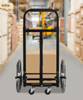 Heavy Duty Stair Climbing Dolly With Ten Wheels For No Sweat Moving, 551 Pound Flat Ground Weight Limit, Foldable Steel Cargo Cart Built Like A Tank For Bulky Furniture And Daily Hauls, viewed from the back with a cardboard box.