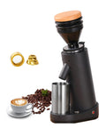 Game Changer Electric Coffee Grinder With Forty Millimeter Stainless Steel Conical Burrs And Nineteen Adjustable Grind Sizes For Perfect Drip French Press And Cold Brew Coffee Setup with coffee cup and beans.