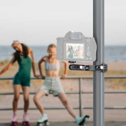 Workhorse Heavy Duty Super Clamp with Magic Arm holding camera on pole by beach, capturing skaters, for versatile setups