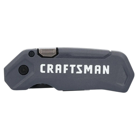Heavy Duty Compact Folding Utility Knife Featuring Slick One Hand Push Button Opening Reversible Carry Clip Quick Blade Swaps And Tough As Nails Lifetime Guarantee For Real World Professionals in gray.