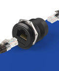Hella Sleek Cat6 Rj45 Panel Mount Connector With Threaded Bulkhead Coupler for Lightning Fast Gigabit Ethernet, cylindrical design.