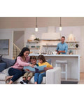 Family in living room with kitchen in background using Diva LED Plus Dimmer Switch For Dimmable LED Halogen And Incandescent Bulbs 250W