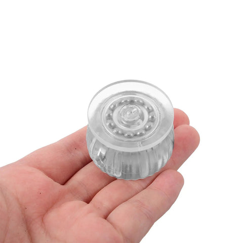 Furniture Casters with Brake Replacement Wheels for Cabinets, clear plastic wheel held in hand, ideal for cabinets.