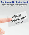 Hand holding customizable two by three inch rectangle labels glossy crystal clear finish that really pops colors perfect for party favors.