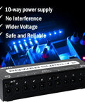 Guitar Pedal Power Supply With 10 Isolated Outputs 9V 12V 18V Options for Distortion Reverb Chorus Stompboxes, black unit under LED lights.