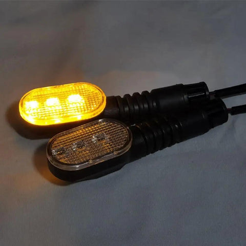 Upgrade Your Ride With This Epic Ebike Tail Light Featuring Bright Led Turn Signals And Wide Voltage Support For 36v To 72V Battery Systems Ensuring You Stay Safe On Night Rides Or In Bad Weather While Looking Awesome. Pair of ABS ebike tail lights, 59mm x 33mm, amber turn signal lit