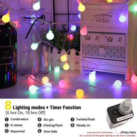 Low Voltage Globe String Lights 33Ft With 100 LEDs 8 Modes And Timer UL Listed illuminated in multi-color on a dresser