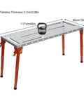 Rock Solid Foldable Welding Bench With Killer 1000 Lb Load Rating And Smooth Height Adjustments From 13 To 21 Inches, showing adjustable legs and 1000lb kettlebell.