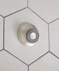 Spot Resistant Remote Dock For Magnetix Handheld Shower Head In Brushed Nickel Finish mounted on tiled wall.