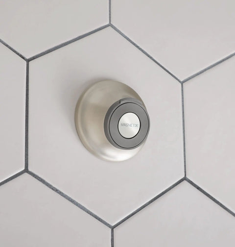 Spot Resistant Remote Dock For Magnetix Handheld Shower Head In Brushed Nickel Finish mounted on tiled wall.
