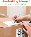 Person writing on 4x6 Thermal Direct Shipping Labels Pack Of 500 Fanfold Commercial Grade For Easy Shipping And Fulfillment Compatible With FedEx UPS USPS Shopify Etsy Amazon eBay Poshmark Mercari And More.