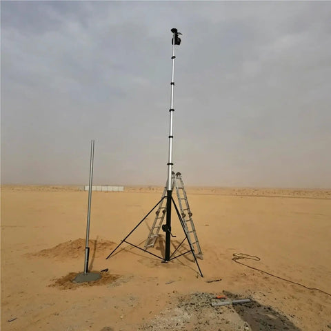 6 Meter Telescopic Aluminum Tripod Mast With Smooth Manual Winch Crank Lifting in desert setting, standing tall for antenna use.