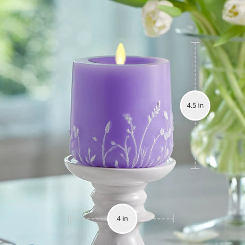 Flameless Moving Flame Goblet Candle With LED Pillar 4 By 4.5 Inch Embossed Floral Print Unscented Real Wax Recessed Edge Timer Remote Ready Lavender Glow on a pedestal