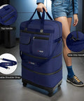 36 Inch Rolling Duffel Bag With Wheels, Expandable Three Layer Design, Hardshell Base For Extra Protection, shown with top handle, side grip handle and removable shoulder strap, in navy.