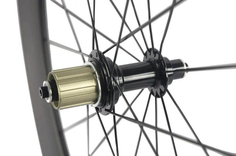 Close-up of Race Ready Carbon Road Wheelset 88mm Deep Clincher 700c with 23mm Width Fits Shimano Cassettes, black hub and spokes