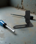 Rock Solid 2 Piece Adjustable Bench Grinder Tool Rest Bracket For Multiple Angles with metal tool holder and screwdrivers.