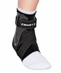 Close-up of A2-DX Black Ankle Brace For Sports, Breathable Ankle Support With Guard Stabilizers And Dual X-Strap System, Left Size Large.