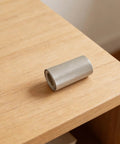 Mica roll on a wooden table, part of Mica Paper Sheet 13x4 Inches Pro Grade High Temperature Flexible Insulation For Heat Guns And Hot Air Blowers