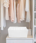Slick Underwear Drawer Organizer With Divided Compartments For Bras Socks And Clothes To Keep Your Closet Neat And Legit A versatile large capacity storage box in a white fabric.