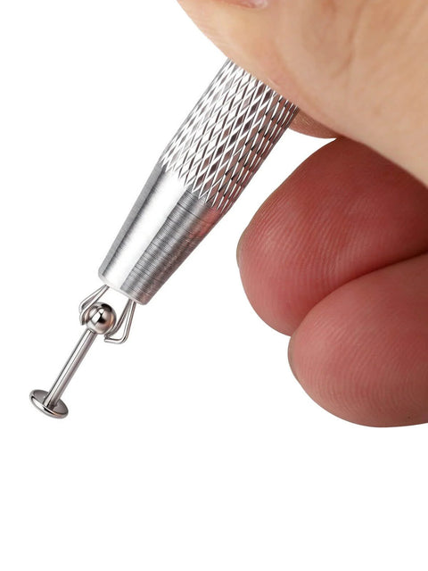 Close-up of Pro Grade All In One Piercing Taper And Ball Grabber Tool Set 14G Through 20G in hand, showing grip detail.