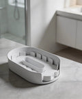 Rotating Condiment And Spice Organizer Turntable with white PET construction and removable tray on kitchen countertop.