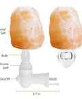 2 Pack Himalayan Salt Lamp Night Light With Rotatable 360 Degree Wall Plug And Four Extra Replacement Bulbs Pink Crystal Rock Salt Hand Crafted For Bedroom Bathroom Relax Glow showing two salt lamps with labeled parts like crystal salt, bulb, silicone pad, and on/off switch.