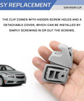 Hand holding gray Sun Visor Clips For Cars Pack Of 2 Replacement Sun Visor Retainer Holders Durable ABS Plastic Bracket Hooks
