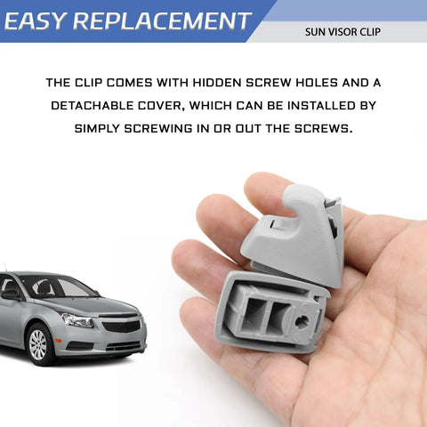 Hand holding gray Sun Visor Clips For Cars Pack Of 2 Replacement Sun Visor Retainer Holders Durable ABS Plastic Bracket Hooks