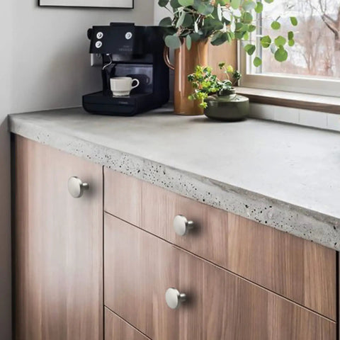 Kitchen scene with 15 Pack Brushed Nickel Cabinet Knobs Round Kitchen Handles Zinc Alloy Hardware For Dresser Drawer Desk Cupboard Durable Finish Easy Install Includes Two Screw Sizes Fits Most Cabinets on wooden drawers.