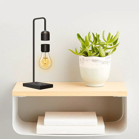 Unique Modern Levitating Lamp With Floating Light And Built In Qi Wireless Charger Sleek Dope Design on wooden shelf