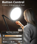 Person adjusting 10 Inch Key Light For Streaming With Adjustable Desk Arm in a dim room, showing button controls and timing options.