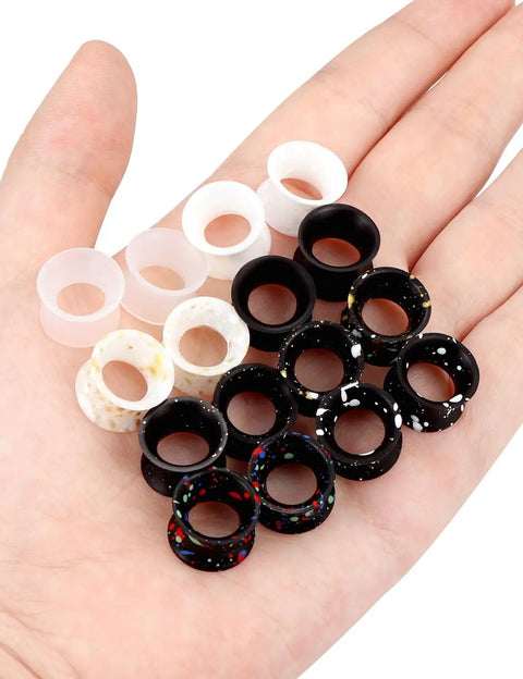 Variety of Silicone Ear Gauges Tunnels Plugs For Ears 10mm 00G Black Invisible Stretching Kit in hand