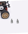 Four Pack Motor Adapter Wheel Connectors For Cross Shaft Coupling And Shaft Adapter Dope Toy Car Accessories shown with toy car chassis.