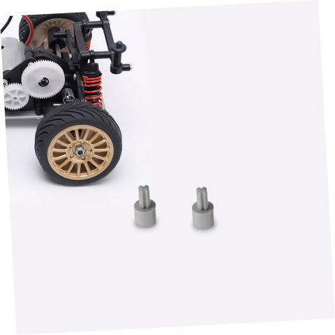 Four Pack Motor Adapter Wheel Connectors For Cross Shaft Coupling And Shaft Adapter Dope Toy Car Accessories shown with toy car chassis.