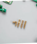 25 Piece Brass Barrel Hinges Set For Small Jewelry Boxes And Wooden Cabinets on gray background