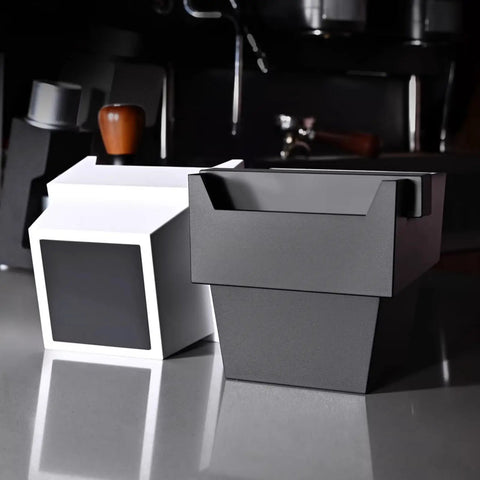 Black and white 1200 ML espresso knock boxes with removable knock bars and non-slip bases, kitchen background