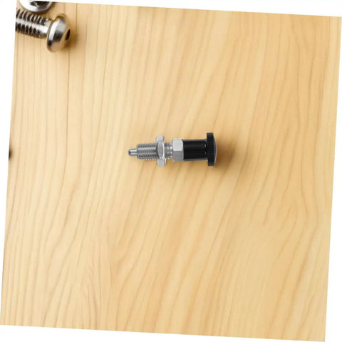 Build Tough Stainless Steel Spring Plunger With Fine Thread Reset Action And Rock Solid Self Locking Grip For Heavy Duty Industrial Assembly And Daily Machine Shop Jobs on wood surface.