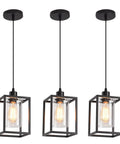Rock Solid Black Pendant Lights For Kitchen Island, 3 Pack Sleek Industrial Farmhouse Lanterns With Adjustable Height and Clear Glass Shade, Vintage Metal Frame Hanging Fixtures For A Fresh Modern Home Vibe, three matte black lanterns with glass shades.