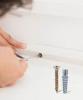 Hands using Drywall Anchors and Screws Kit 40 Sets Heavy Duty Rust Proof Steel Construction for Concrete and Dry Walls