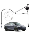 Straight Up Genius For Home EV Charging With This Overhead Retractable Cord Reel boasting a 6.6 foot reach next to a parked EV.