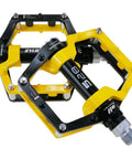 Yellow and black aluminum mountain bike pedals flat pedals for MTB and BMX with removable non slip studs nine sixteenths inch spindle