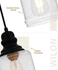 Slick Five Point Five Inch Seeded Glass Mini Pendant Light Featuring Badass Black Metal Hanging Fixtures For Kitchen Island And Dining Room showing seeded glass shade and black metal fixture.
