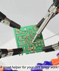 No Hands Soldering Clamp Aid With Four Alligator Clips Wire Clip Holder in use with a circuit board and soldering iron