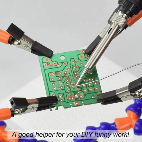 No Hands Soldering Clamp Aid With Four Alligator Clips Wire Clip Holder in use with a circuit board and soldering iron