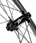 Close-up of the hub and spokes on a Tubeless Carbon Fiber Wheelset 38mm And 31mm For 700c Road Bikes, Disc Brake, UCI Approved.